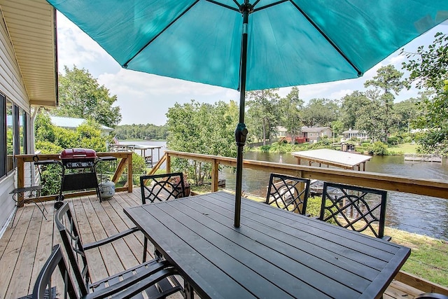 deck featuring a grill and a water view