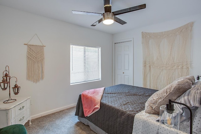 bedroom with a closet, carpet floors, and ceiling fan