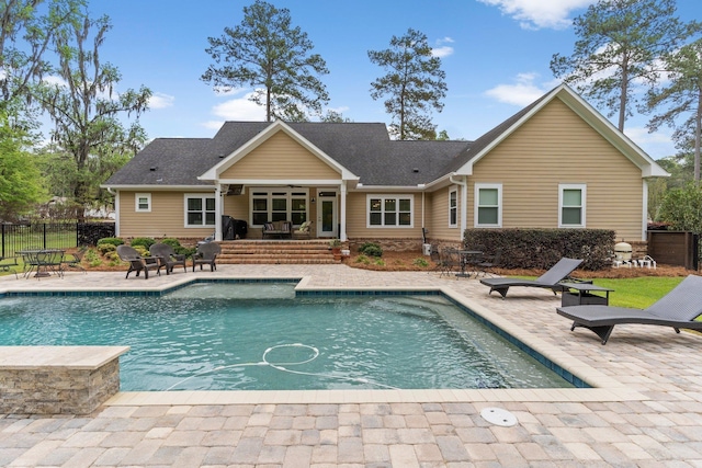 view of pool featuring a ceiling fan, fence, a fenced in pool, and a patio