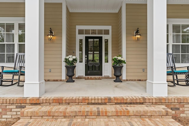 doorway to property with a porch