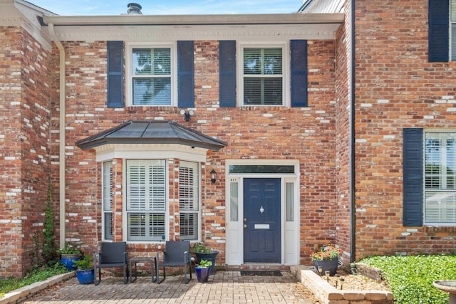821 Beard St, Tallahassee, FL 32303 - property entrance with brick siding and a patio