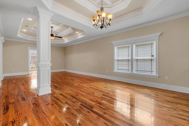 interior space with a raised ceiling, ornate columns, and ornamental molding