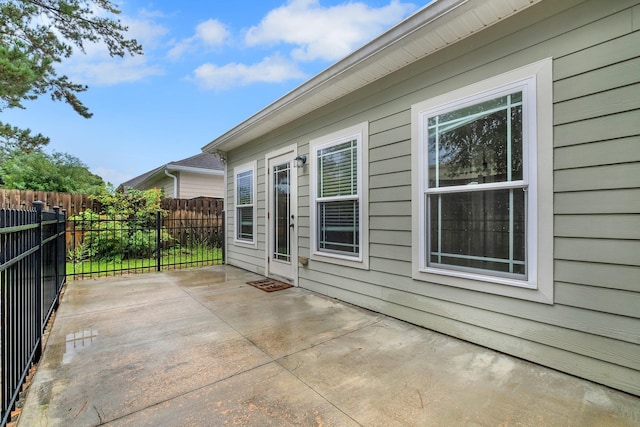 view of side of property featuring a patio area