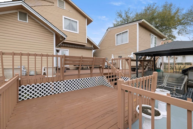 wooden deck featuring a gazebo