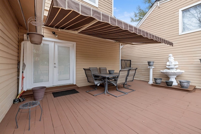 wooden deck featuring french doors