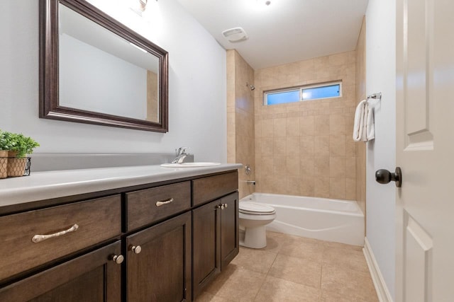 full bath with baseboards, toilet, tile patterned floors, vanity, and shower / bathing tub combination