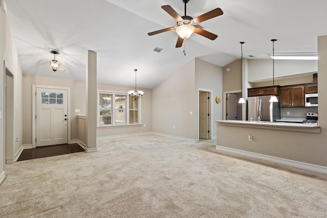 unfurnished living room with baseboards, visible vents, carpet floors, high vaulted ceiling, and ceiling fan with notable chandelier