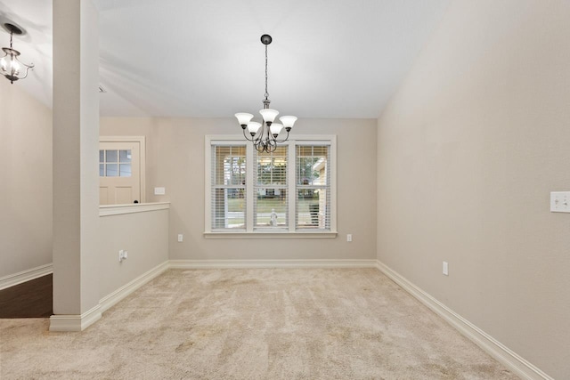 unfurnished room with a chandelier, vaulted ceiling, baseboards, and light colored carpet