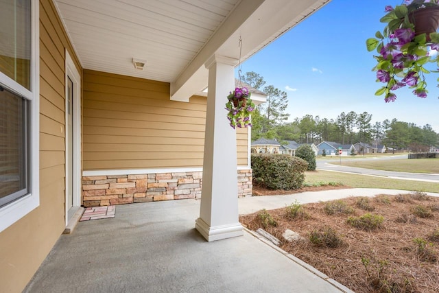 view of patio with a residential view and a porch