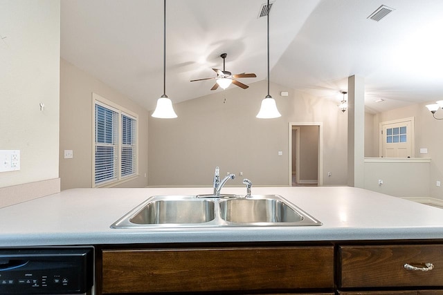 kitchen featuring dishwashing machine, a sink, and light countertops