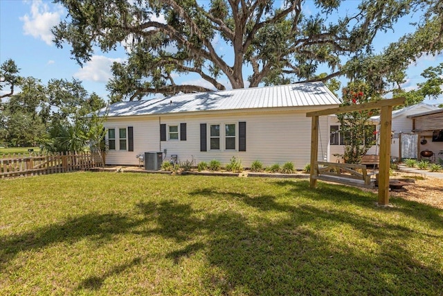 514 N Calhoun St, Perry, FL 32347 - back of house with a metal roof