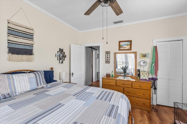 514 N Calhoun St, Perry, FL 32347 - bedroom with ornamental molding, wood finished floors, and a ceiling fan