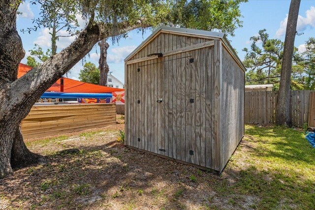 514 N Calhoun St, Perry, FL 32347 - view of shed with a fenced backyard