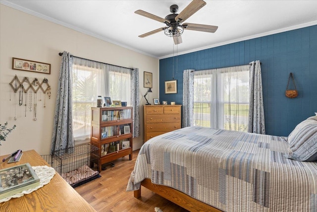 514 N Calhoun St, Perry, FL 32347 - bedroom with crown molding, multiple windows, wood finished floors, and ceiling fan