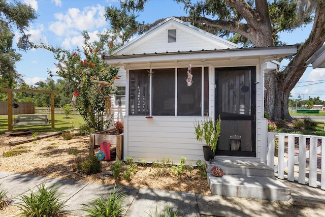 514 N Calhoun St, Perry, FL 32347 - view of front of house featuring a sunroom