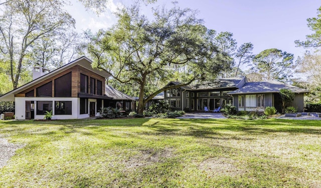 view of yard with a sunroom