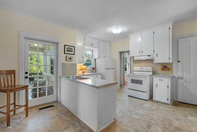 kitchen with kitchen peninsula, sink, crown molding, white appliances, and white cabinets