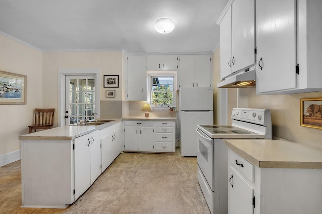 kitchen with white appliances, white cabinets, sink, kitchen peninsula, and crown molding