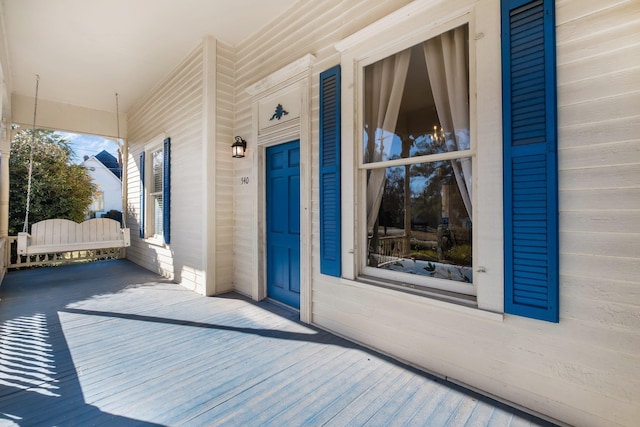 view of exterior entry featuring a porch