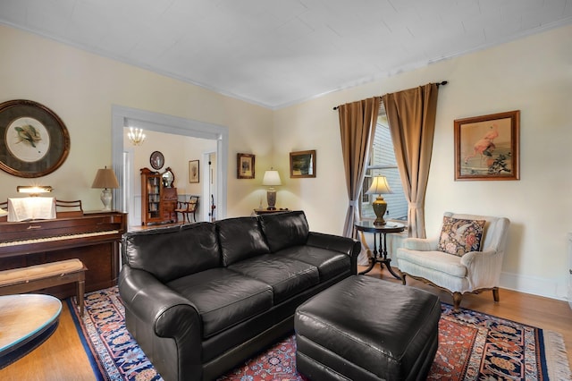 living room featuring hardwood / wood-style floors and a notable chandelier