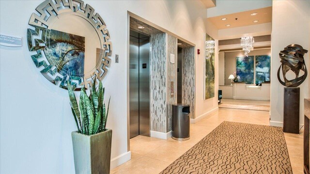 300 S Duval St Unit 2209, Tallahassee, FL 32301 - hallway featuring a chandelier, elevator, recessed lighting, and tile patterned floors