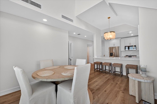 300 S Duval St Unit 2209, Tallahassee, FL 32301 - kitchen featuring appliances with stainless steel finishes, electric panel, light wood-style flooring, light stone countertops, and white cabinets