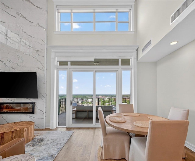 300 S Duval St Unit 2209, Tallahassee, FL 32301 - dining space featuring wood finished floors and a towering ceiling