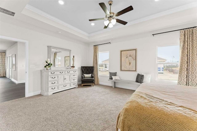 bedroom with multiple windows, carpet flooring, ceiling fan, and crown molding