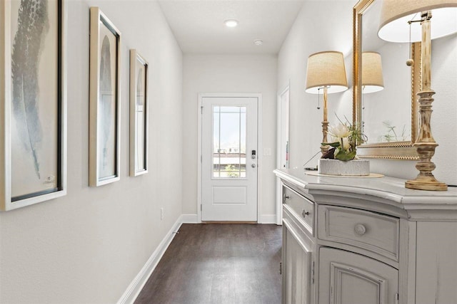 doorway to outside featuring dark hardwood / wood-style floors