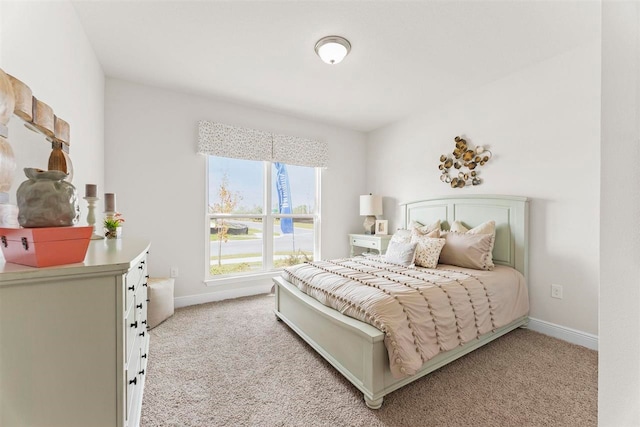 bedroom featuring light carpet