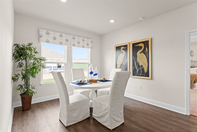 dining area featuring dark hardwood / wood-style flooring