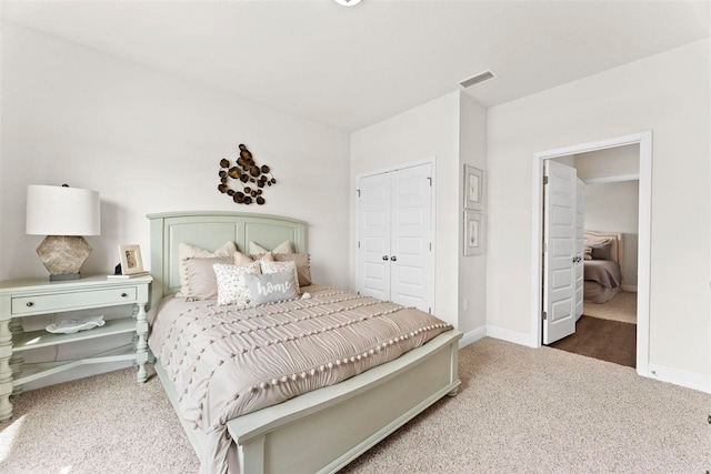 bedroom featuring a closet and carpet flooring