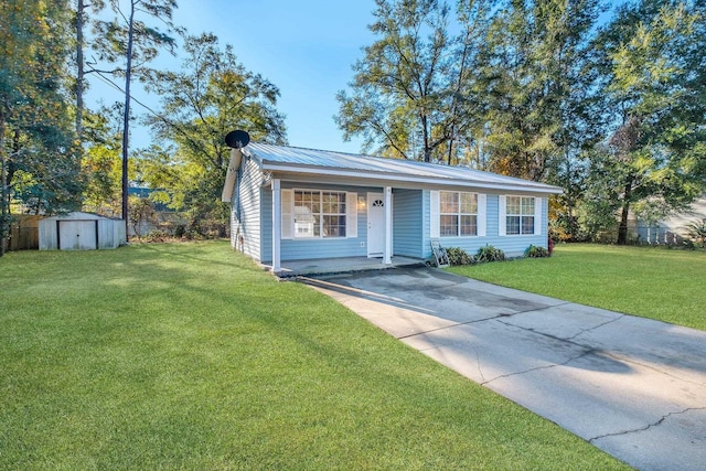 ranch-style house featuring a front lawn, covered porch, and a storage unit