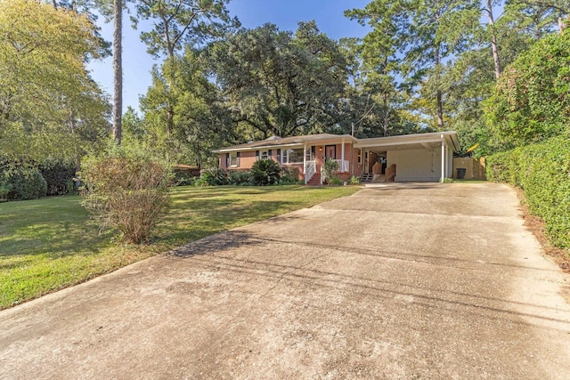 ranch-style house featuring a carport and a front yard