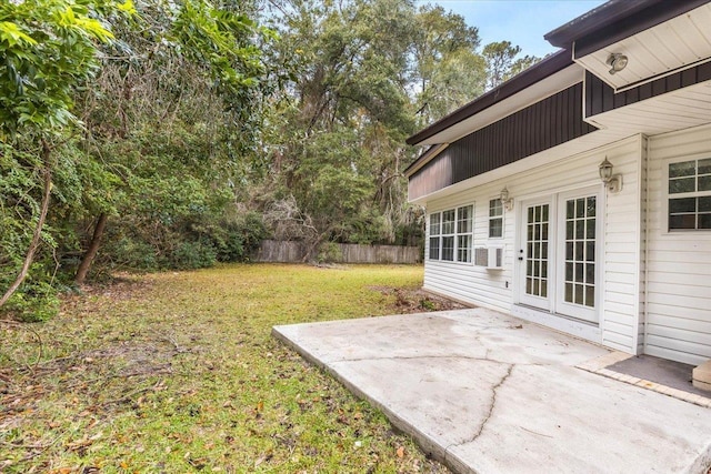 view of yard featuring french doors and a patio