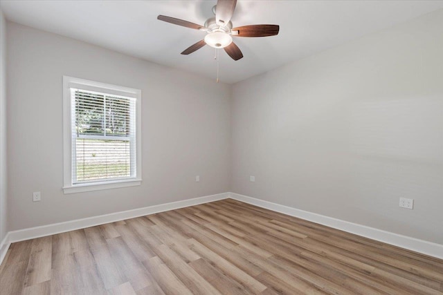 empty room with light hardwood / wood-style flooring and ceiling fan