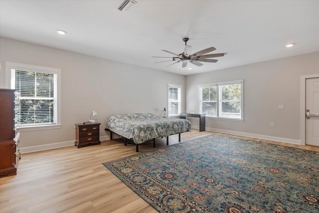 bedroom featuring light hardwood / wood-style flooring and ceiling fan