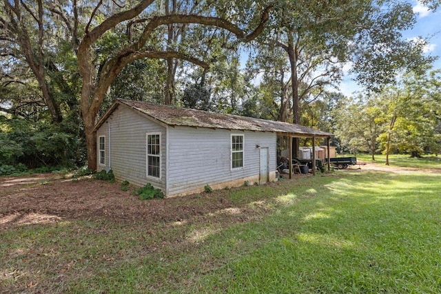 view of home's exterior with a lawn