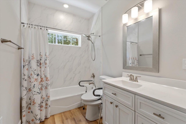 full bathroom featuring wood-type flooring, vanity, toilet, and shower / bath combination with curtain