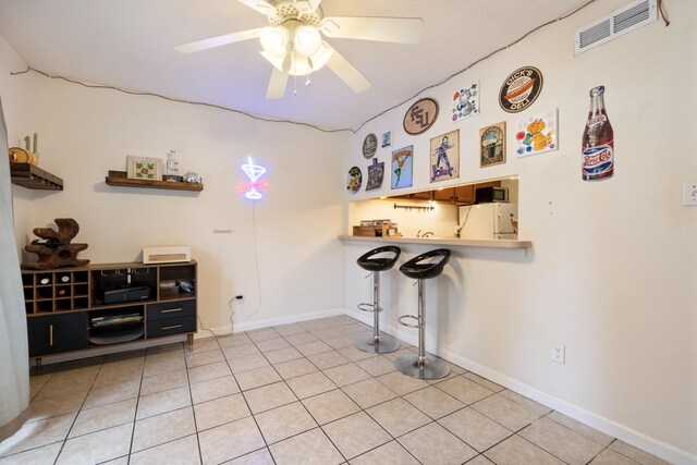 2020 Continental Ave Unit 144, Tallahassee, FL 32304 - kitchen with white electric range oven, under cabinet range hood, dishwasher, and brown cabinets