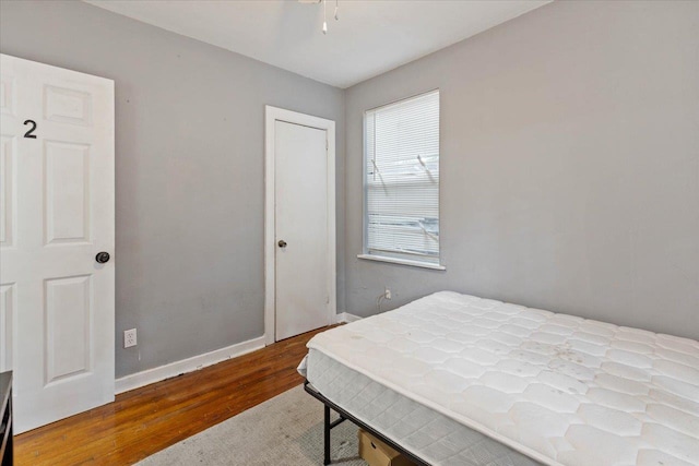 bedroom with hardwood / wood-style floors