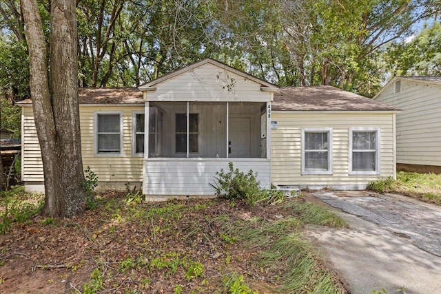 view of front of house with a sunroom