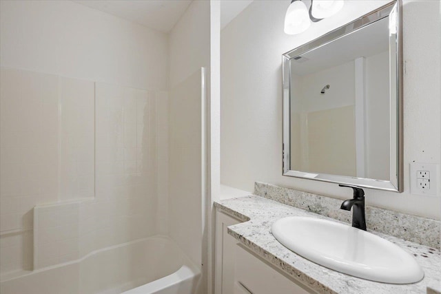 bathroom featuring vanity and shower / bathtub combination