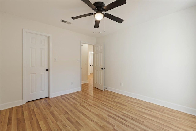 unfurnished bedroom with ceiling fan and light wood-type flooring