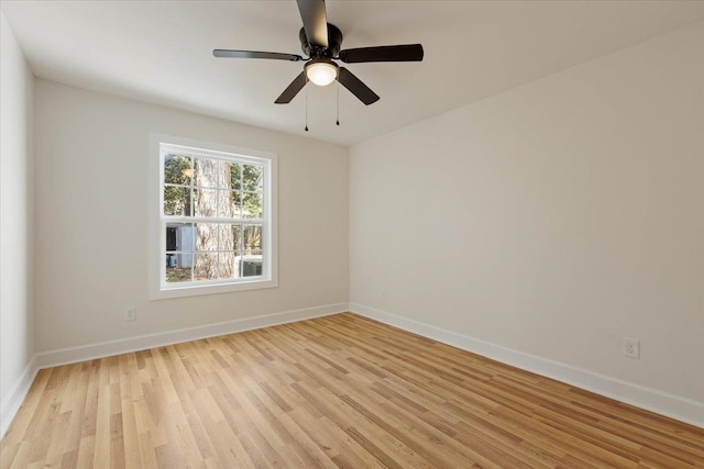 empty room with light hardwood / wood-style floors and ceiling fan