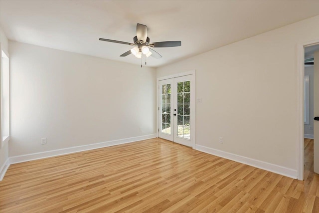 spare room with light wood-type flooring, french doors, and ceiling fan