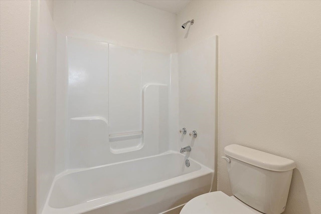 bathroom with toilet and shower / tub combination