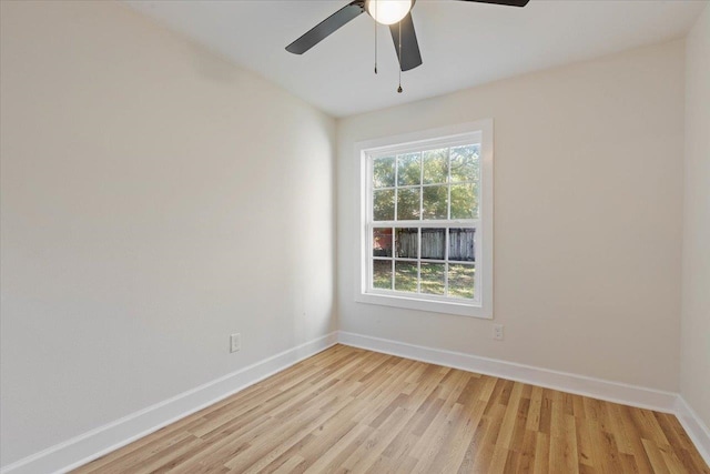 unfurnished room featuring light wood-type flooring and ceiling fan