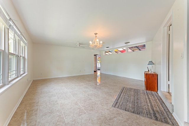 spare room with baseboards, an inviting chandelier, and light tile patterned floors