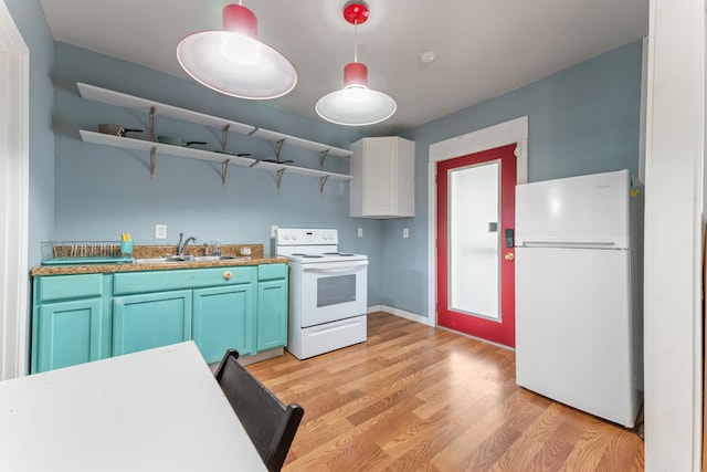 kitchen with decorative light fixtures, open shelves, white appliances, a sink, and light wood-style flooring